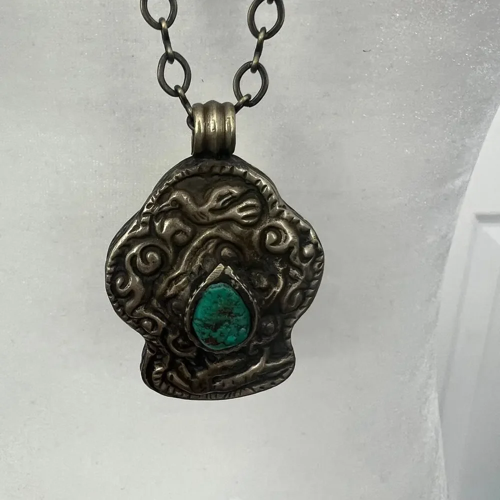 Vintage silver pendant necklace with turquoise stone - intricate animal design
